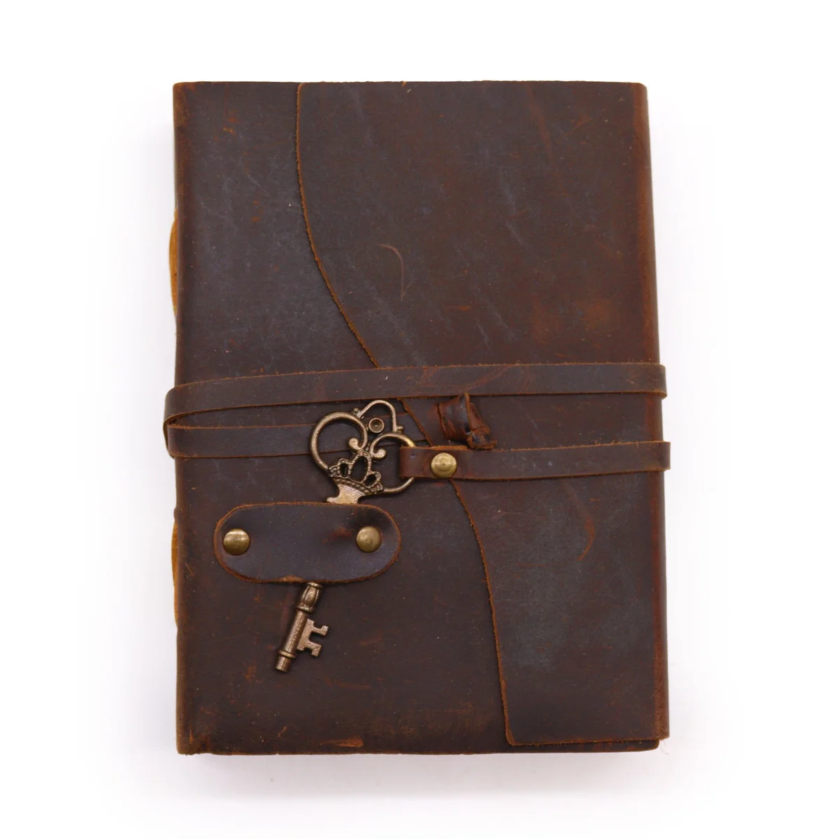 Oiled leather journal with key detail, 200 decle-edged pages, measuring 13x18cm, closed on white background