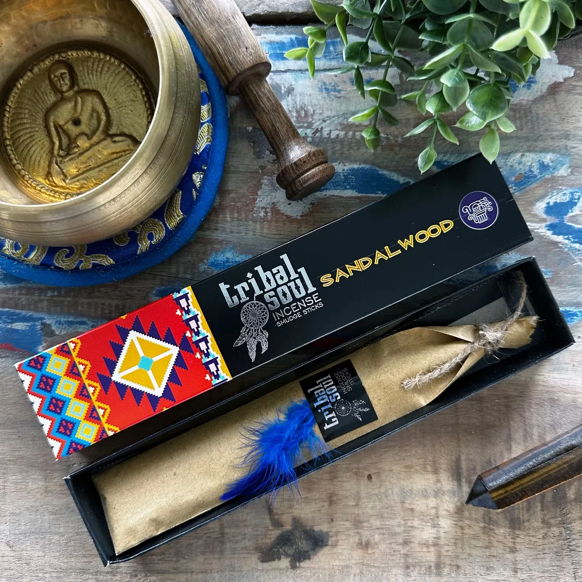 Tribal Soul Sandalwood aromatherapy incense sticks arranged with smoke wafting against a plain background