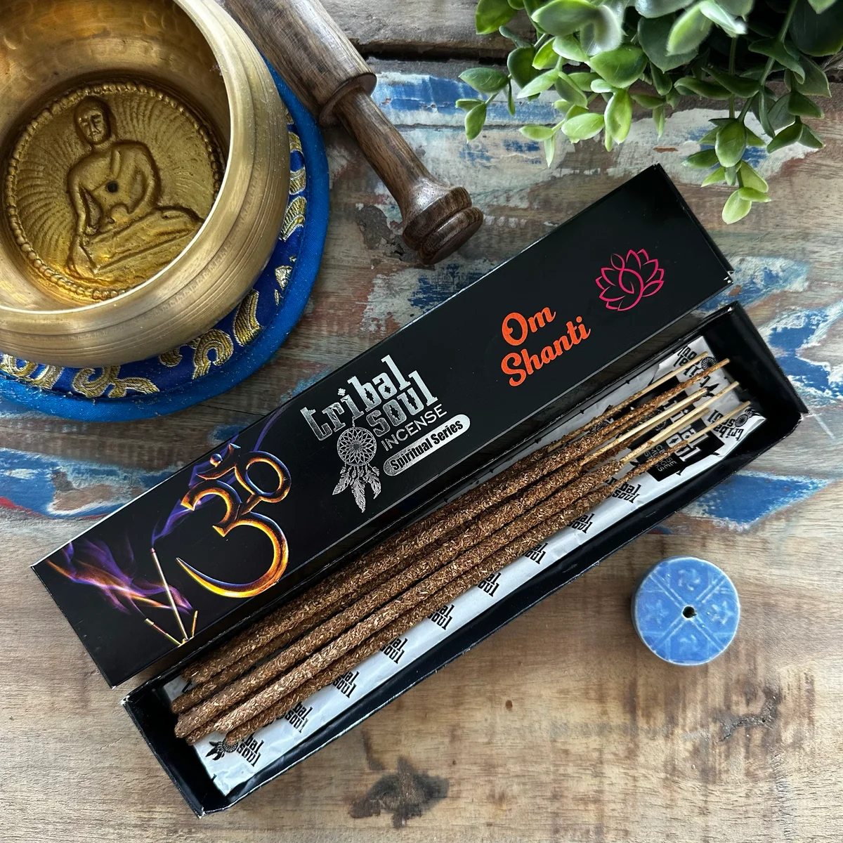 Ohm Shanti incense sticks arranged in a ceramic holder with Tribal Soul Spiritual branding visible
