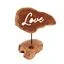 Romantic candle holder featuring a Love sign with stylized lettering and a small candlestick