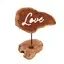 Stylish candle holder sign shaped like the word Love.