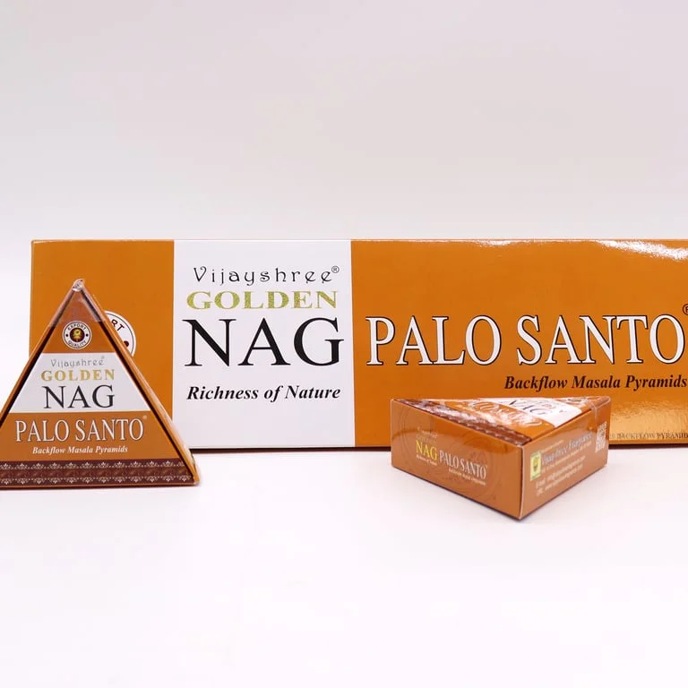 Bright golden jumbo incense cones displayed on a flat surface.