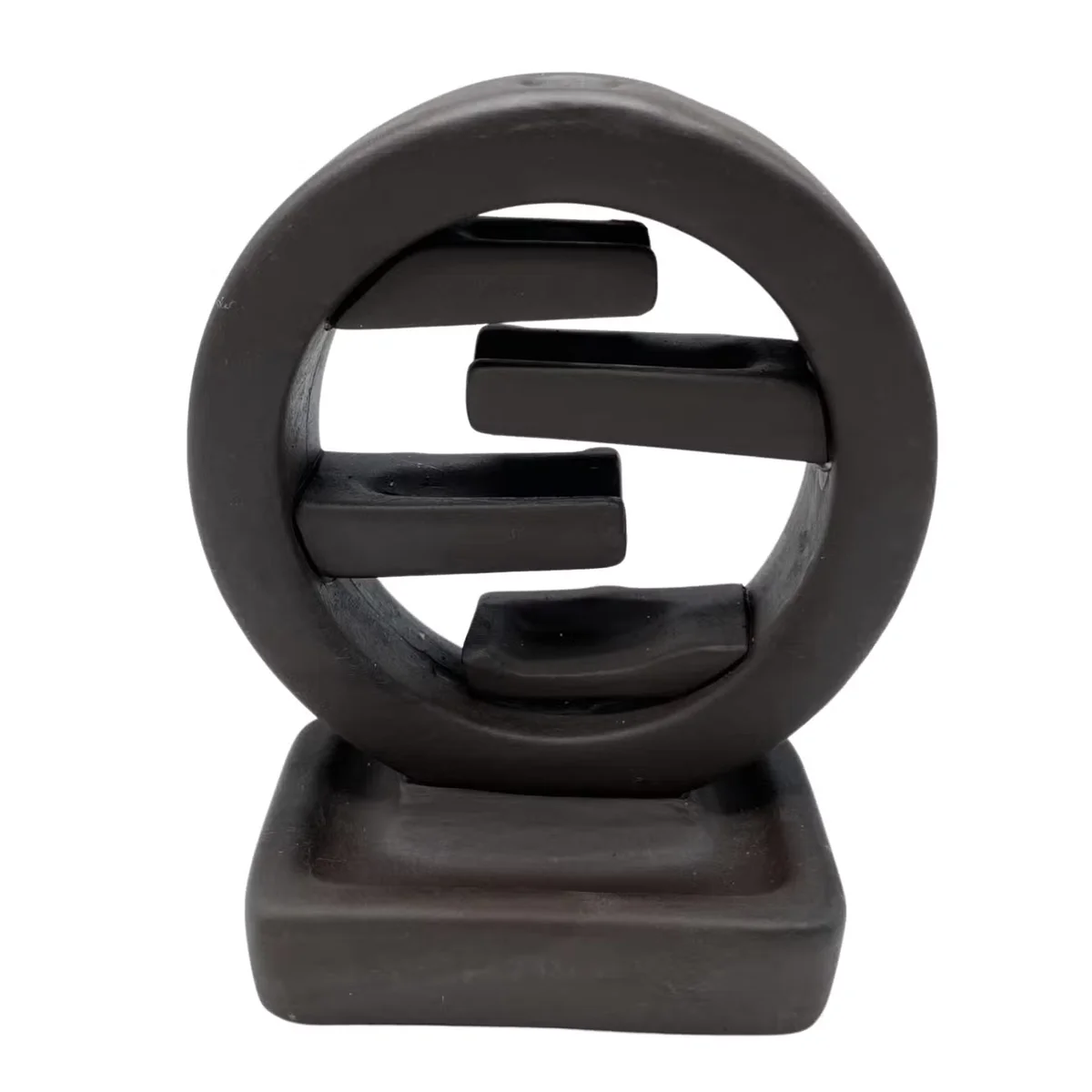 Decorative incense holder shaped as a Zen Circle of Life backflow incense burner on a plain background