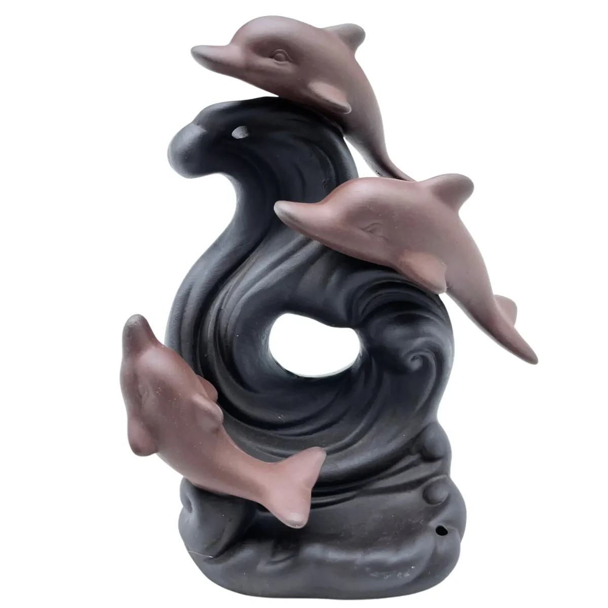 Dolphin incense burner shaped like a wave with backflow incense smoke effect on a white background