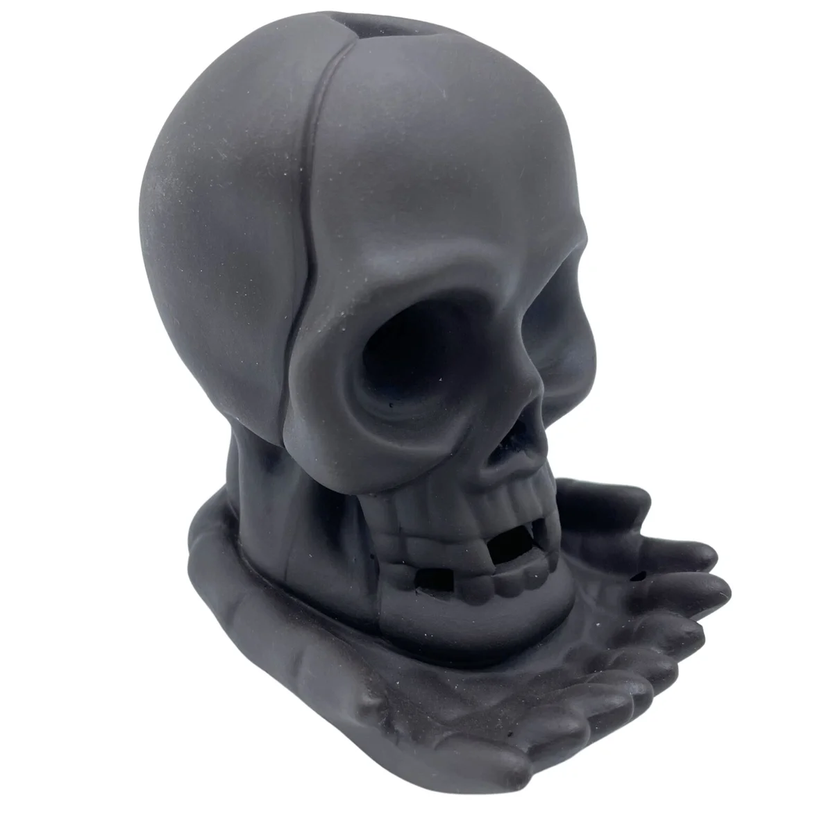 Weeping skull backflow incense burner with light, designed to create cascading smoke effect