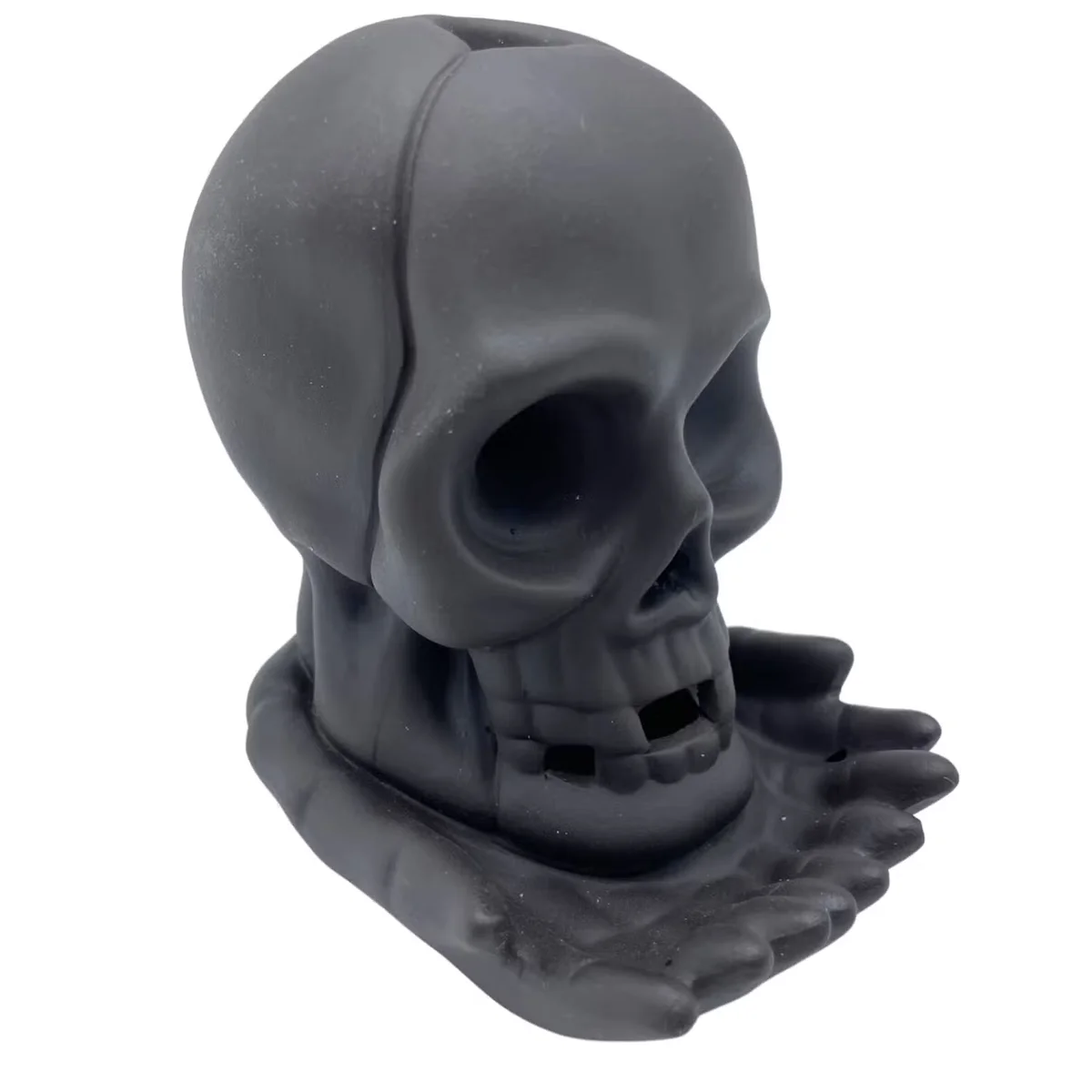 Weeping Skull backflow incense burner with light, decorative incense holder emitting smoke downwards