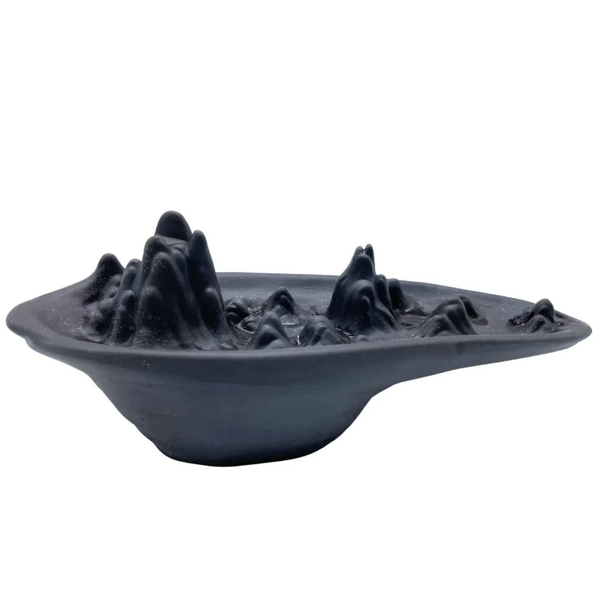 Ceramic mountain scape incense burner designed for backflow incense cones, showing layered mountain shapes and smoke flow