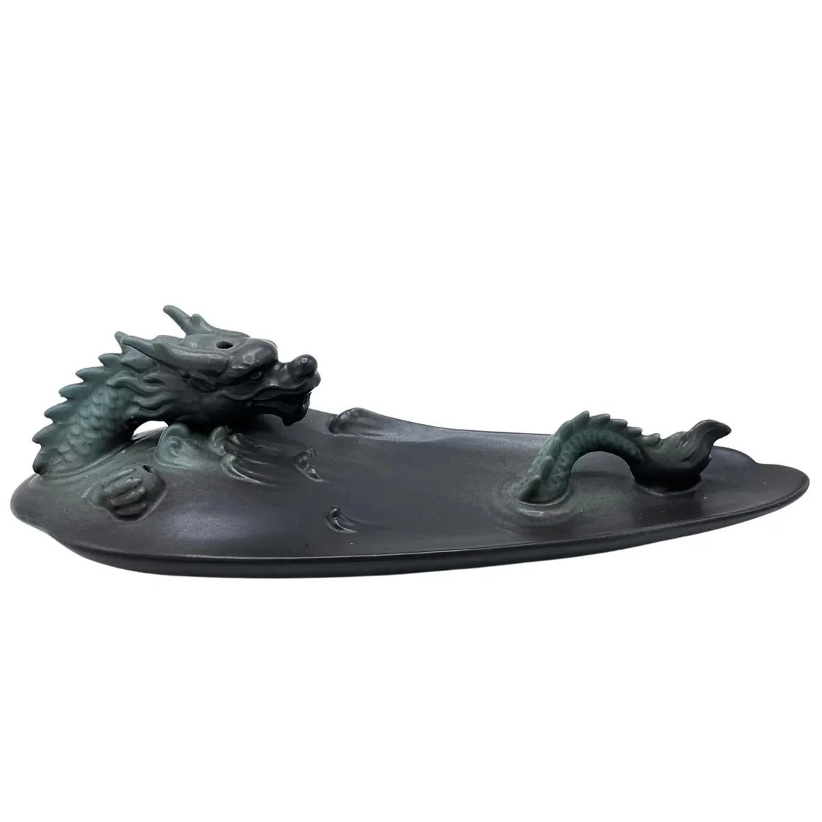 Dragon incense burner featuring a detailed dragon design resting in a pool, crafted for backflow incense use.