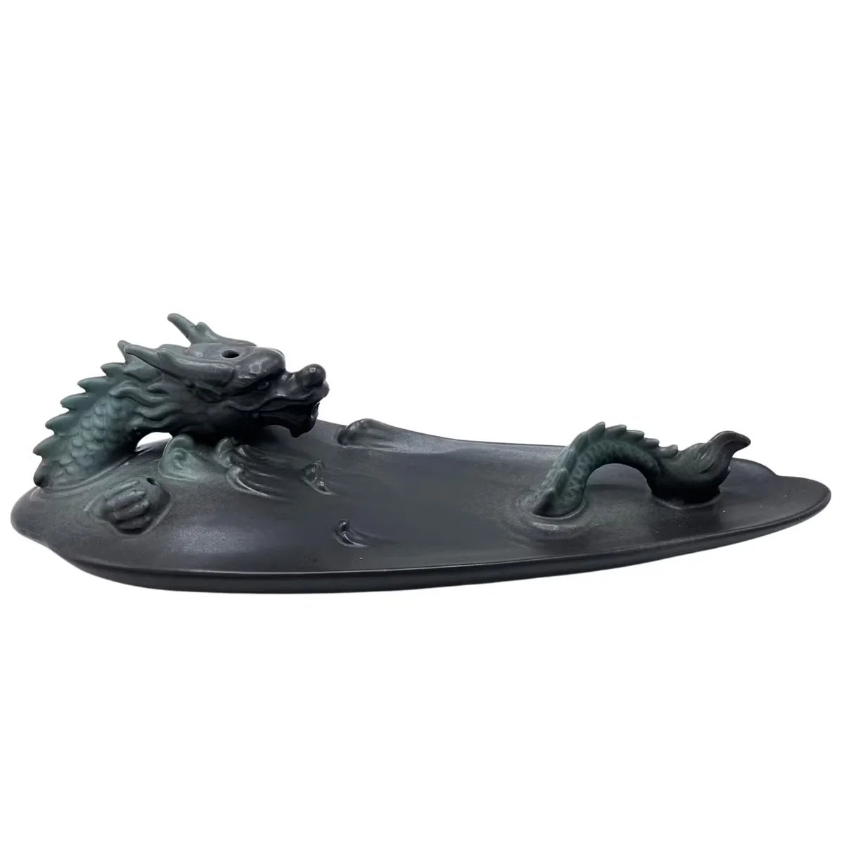 Decorative incense holder featuring a detailed dragon in a pool design for backflow incense burning