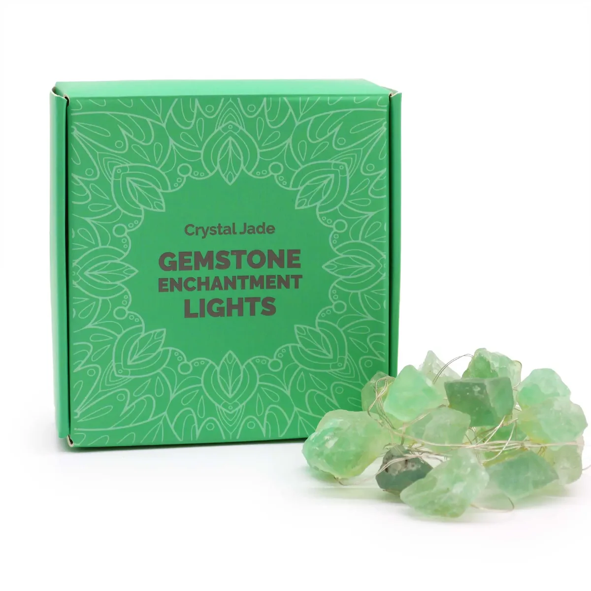 Crystal jade gemstone enchantment lights glowing softly with green hues on a white background