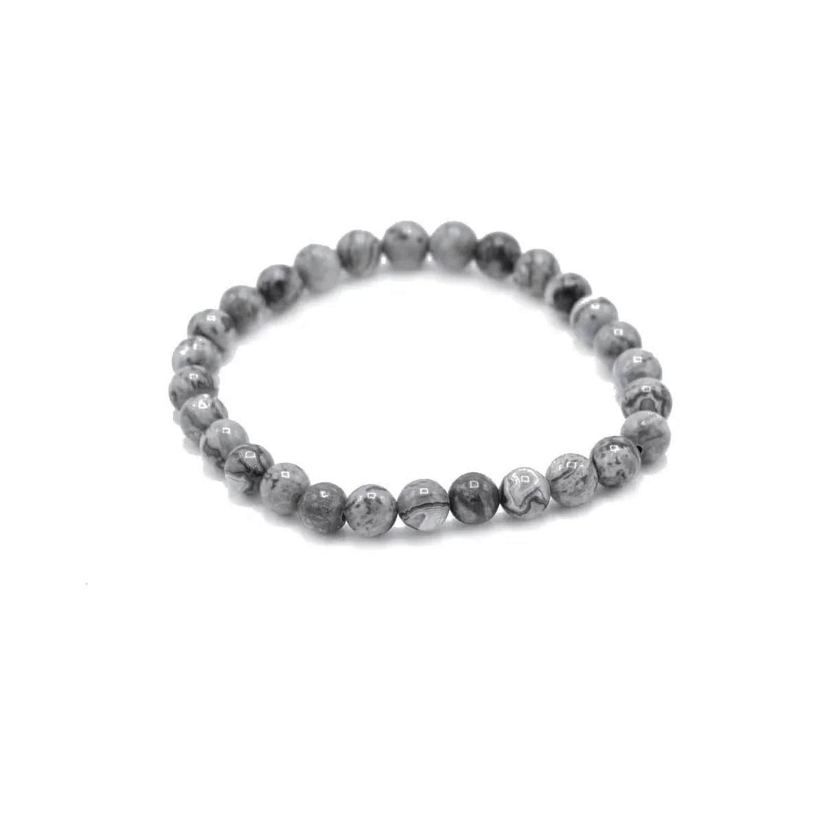 Spiritual gemstone bracelet made with map stone for prosperity, worn on a wrist.