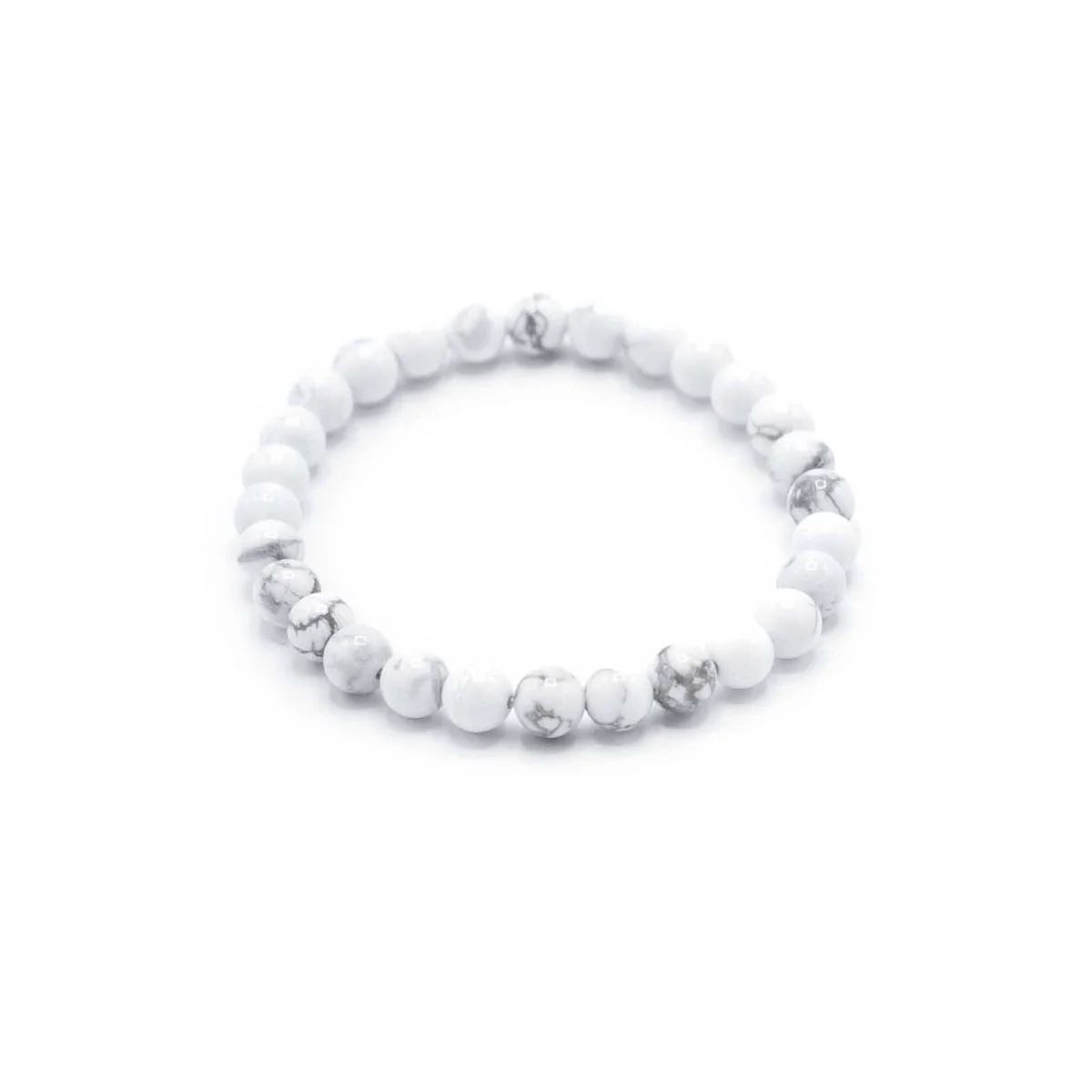 White jasper bracelet displayed on a wrist, featuring smooth stones and subtle design.