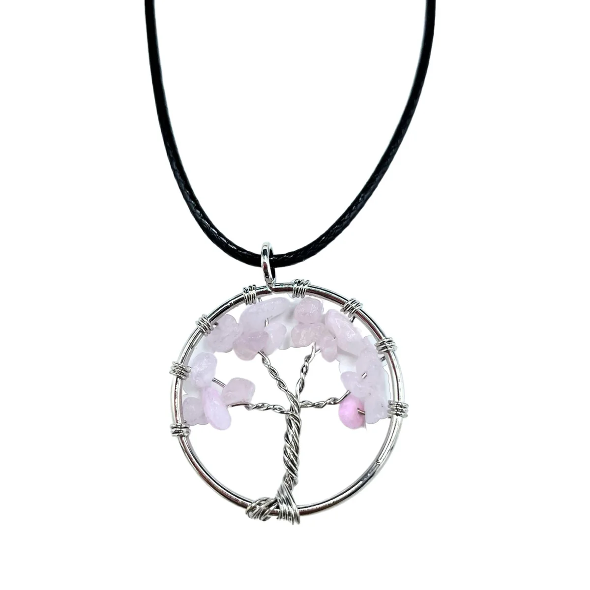 Women's tree necklace with a rose quartz pendant shaped as a tree of life, hanging on a thin chain.