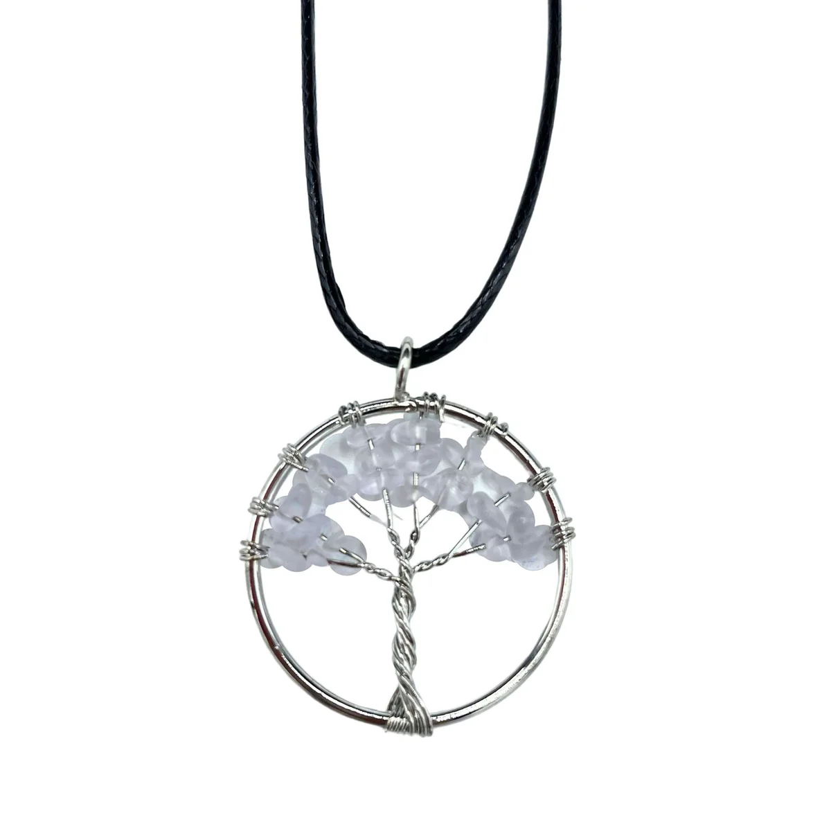 Tree of life pendant featuring a clear rock crystal centerpiece.