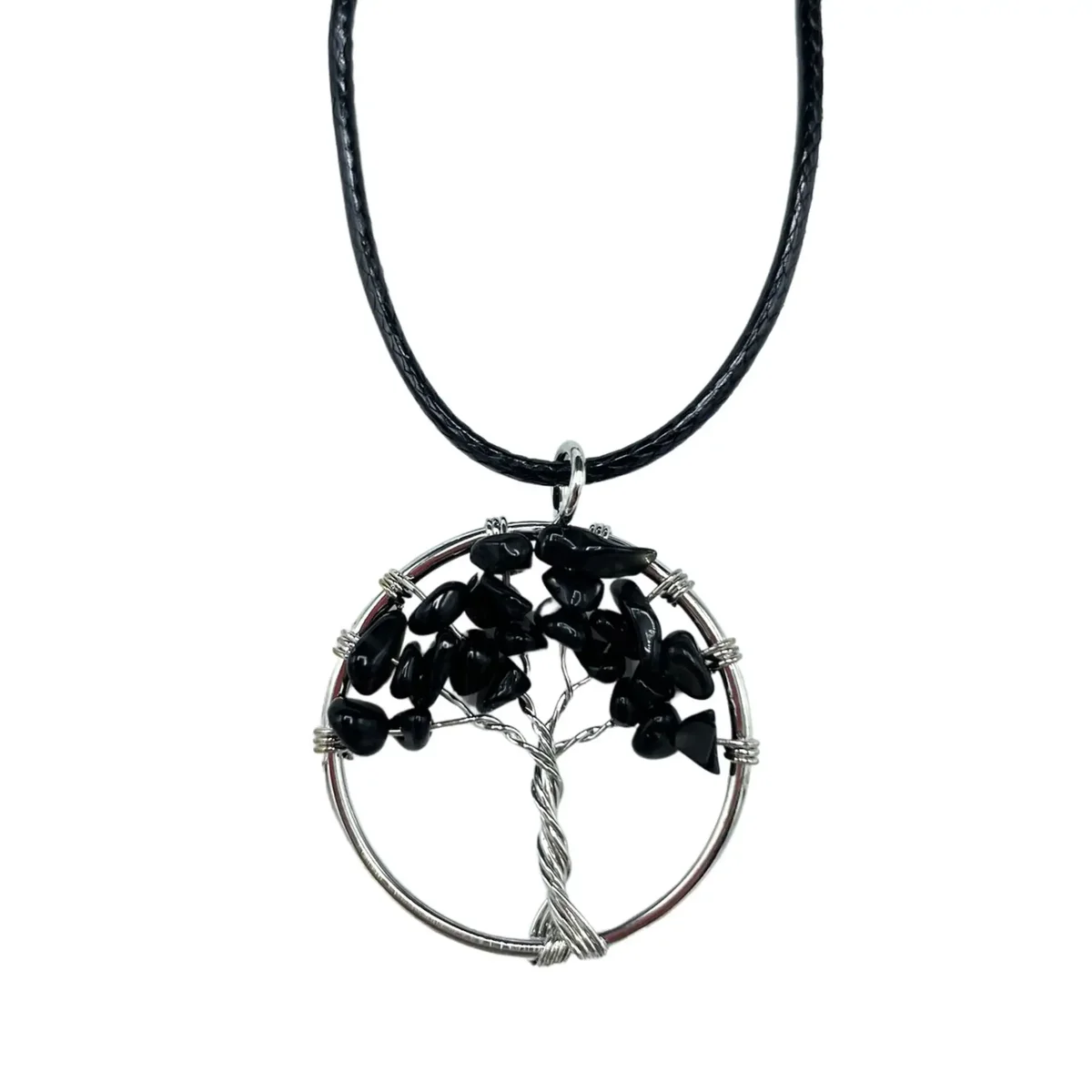 Black agate tree of life pendant necklace on a dark background