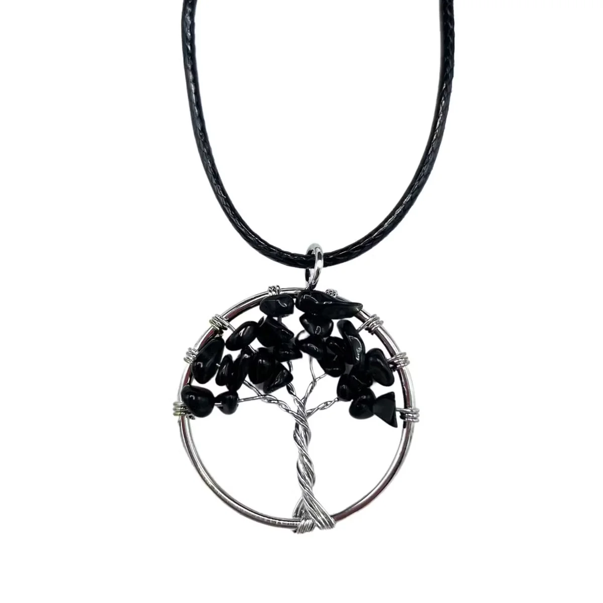 Black agate Tree of Life pendant hanging on a delicate chain, showcased as an agate pendant necklace