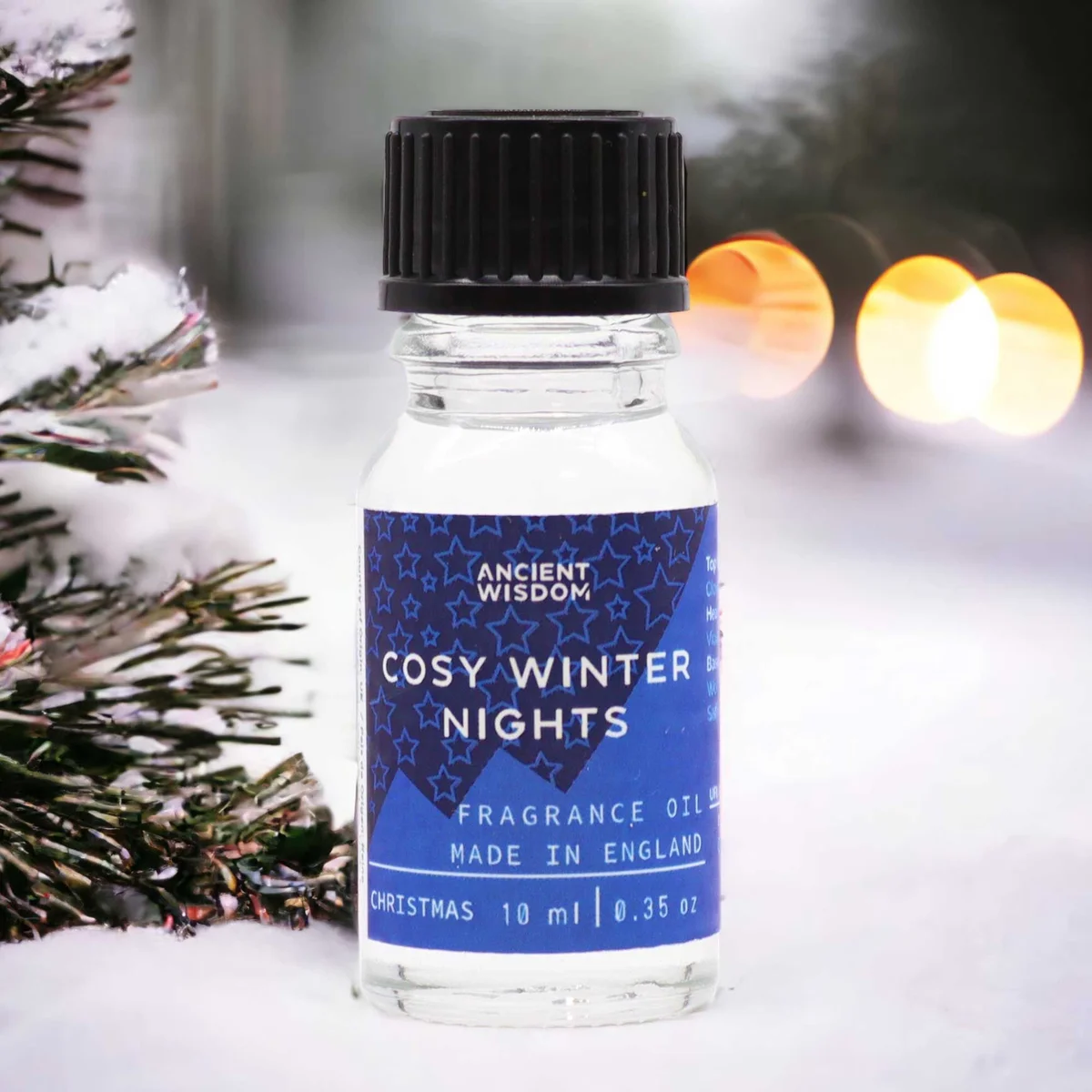 Small 10ml bottle of Cosy Winter Nights winter fragrance oil with label on a white background