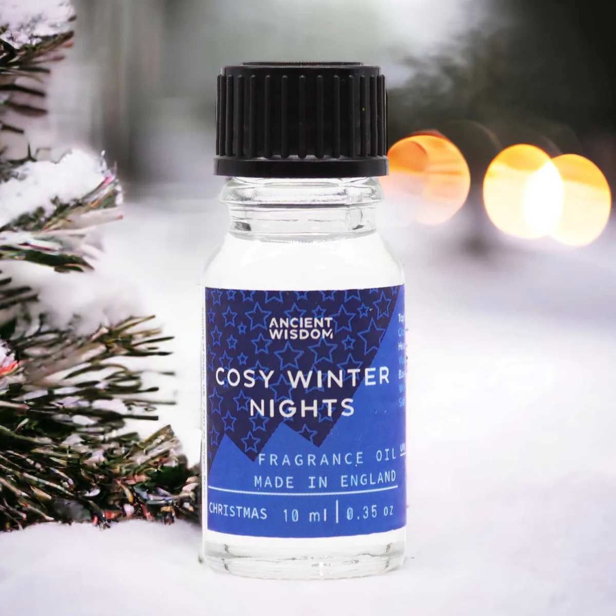 Small 10ml fragrance oil bottle labeled Cosy Winter Nights with warm winter-themed packaging design