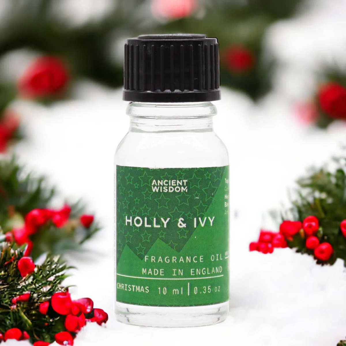 Small 10ml bottle of holly and ivy fragrance oil with label on a white background