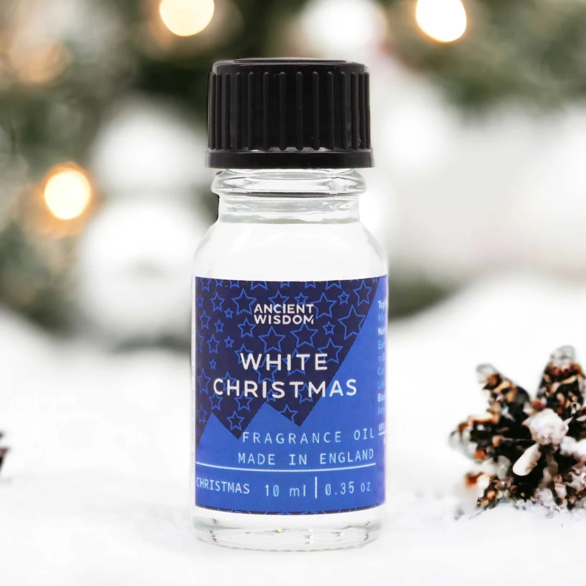 Small 10ml bottle of white christmas fragrance oil with label on a white background