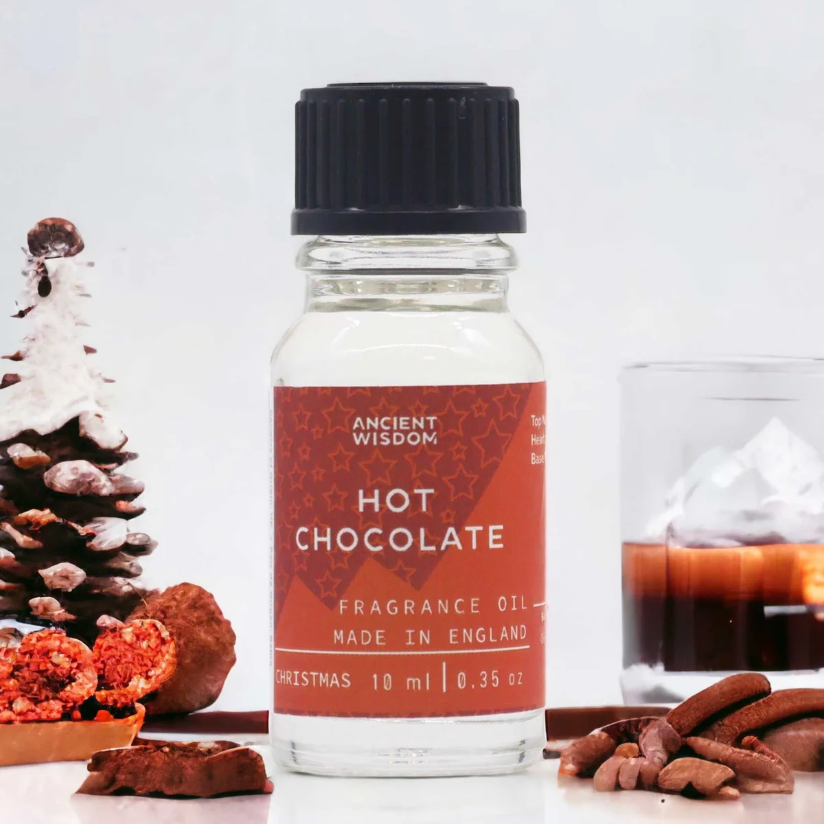 Small 10ml bottle of hot chocolate fragrance oil with brown label and black cap on white background