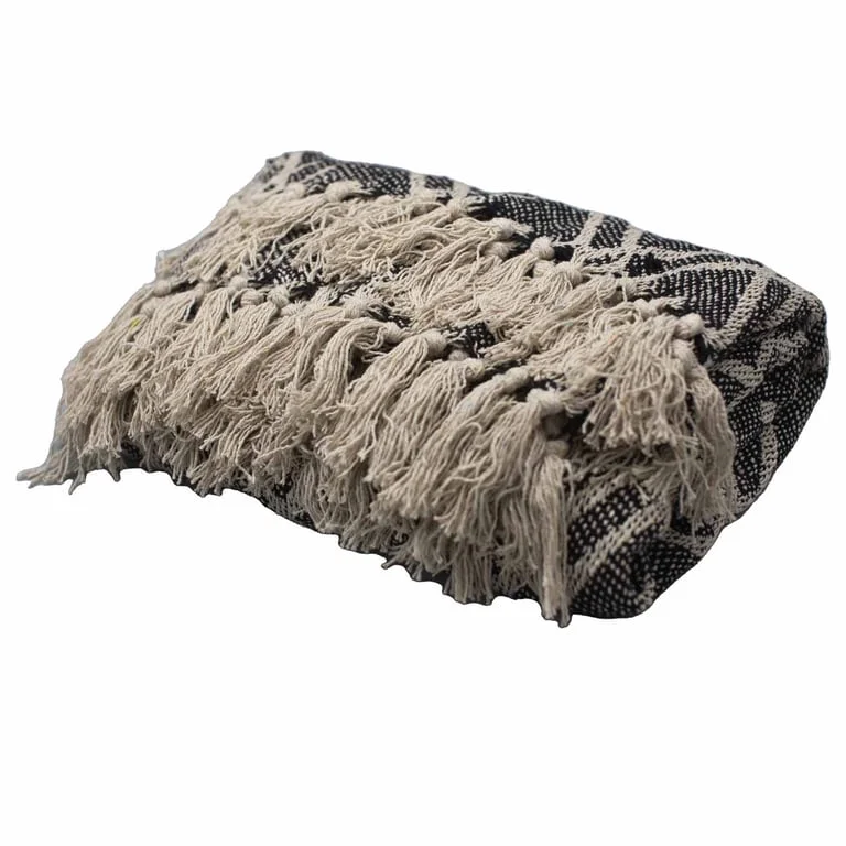 Black and beige throws from Regency boho comfort collection displayed on a clean flat surface.