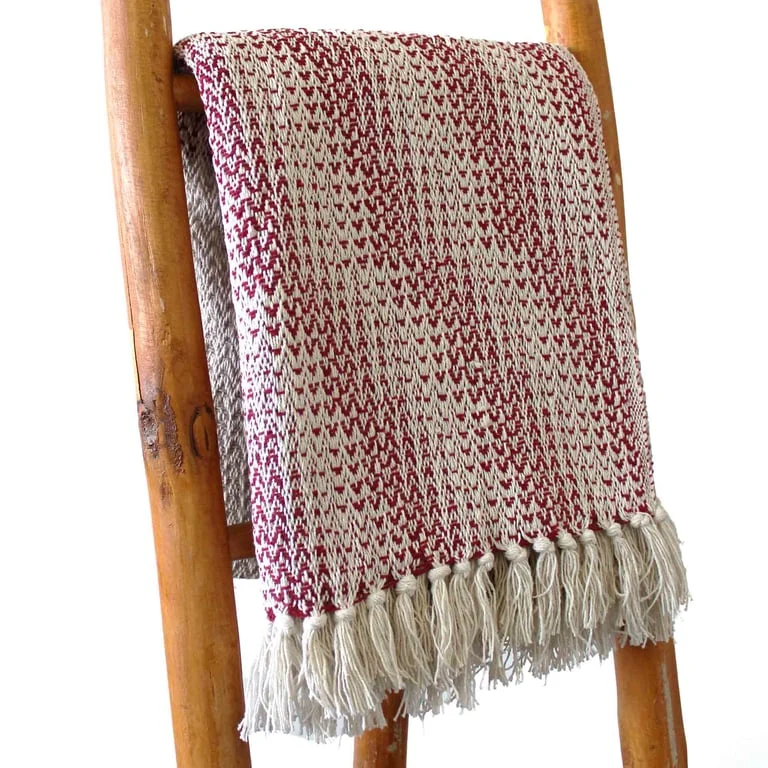 Soft boho throw blanket in ruby two tone throw, split‑colour design with v‑shape pattern.