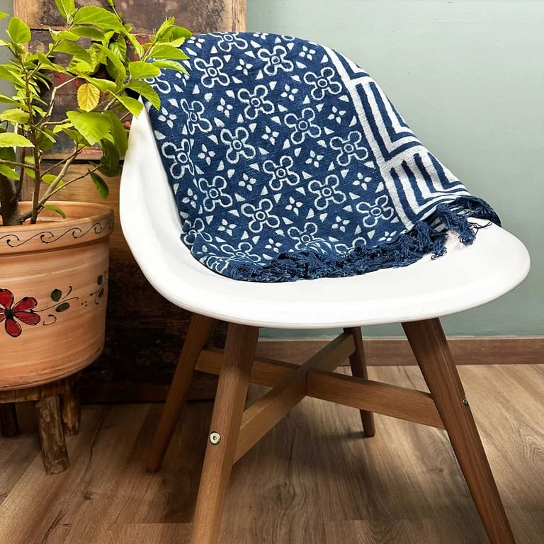 Handmade indigo throw (170x120cm) displayed flat, showing deep indigo fabric and soft texture.