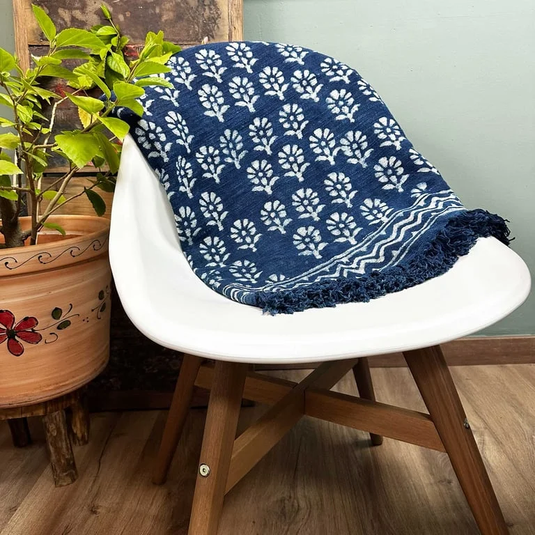 Handmade indigo throw blanket, 170x120cm, featuring a subtle flower pattern.