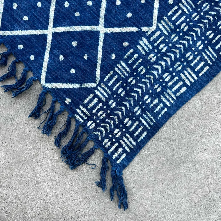Handmade indigo throw, 170x120cm, Midnight Heerak, displayed draped over a couch