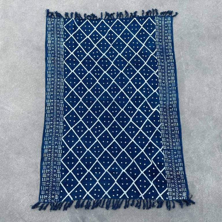 Handmade indigo throw blanket on sofa, midnight heerak throw