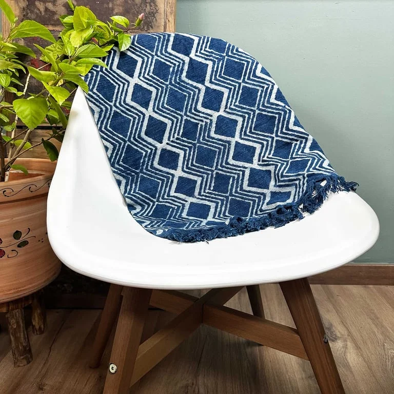 Handmade indigo runner 170x60cm displayed rolled on a wooden plank
