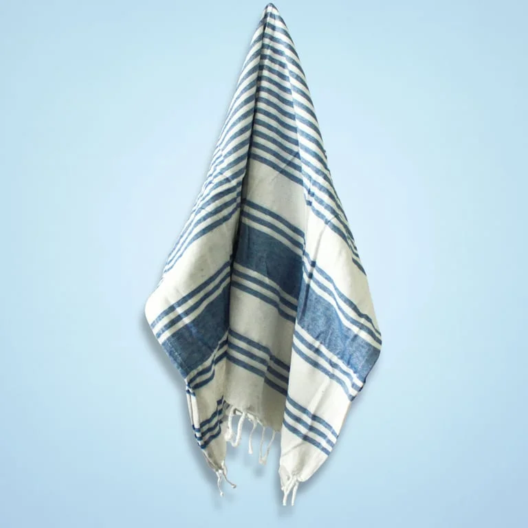 Ocean blue towel from Hamman Spa, 90x170cm, neatly folded.