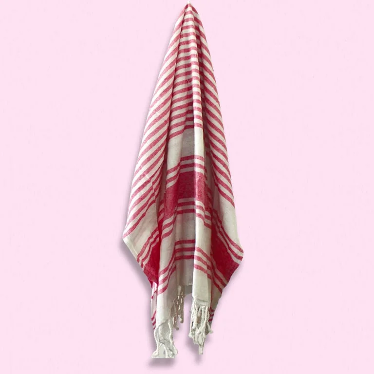 hamman spa towel in sunset pink, 90x170cm, folded elegantly on a rack