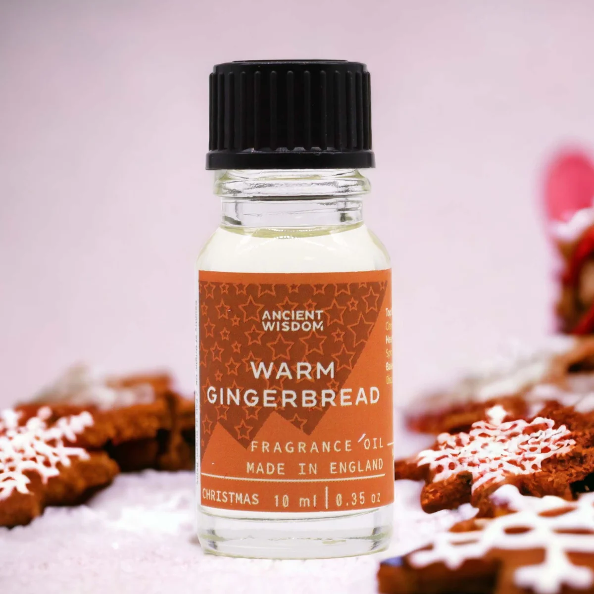Small 10ml fragrance oil bottle labeled Warm Gingerbread Fragrance Oil with festive gingerbread cookie design