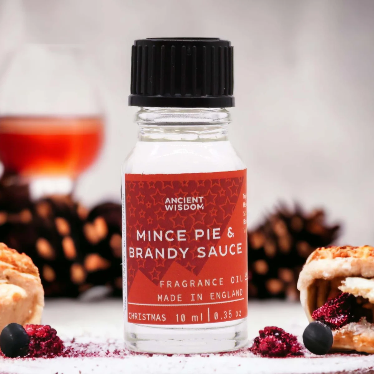 Small 10ml bottle of mince pie & brandy sauce holiday fragrance oil with label on white background