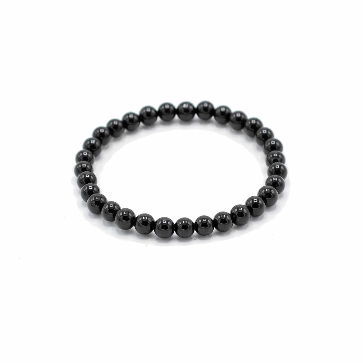 Black Agate gemstone protection bracelet with polished round beads on a stretchy cord, ideal for manifestation and protection