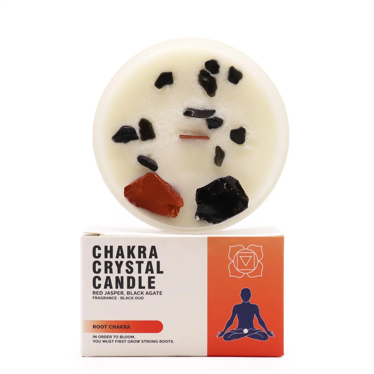 Red chakra crystal candle designed for the Root Chakra, with a smooth wax finish and embedded crystals.