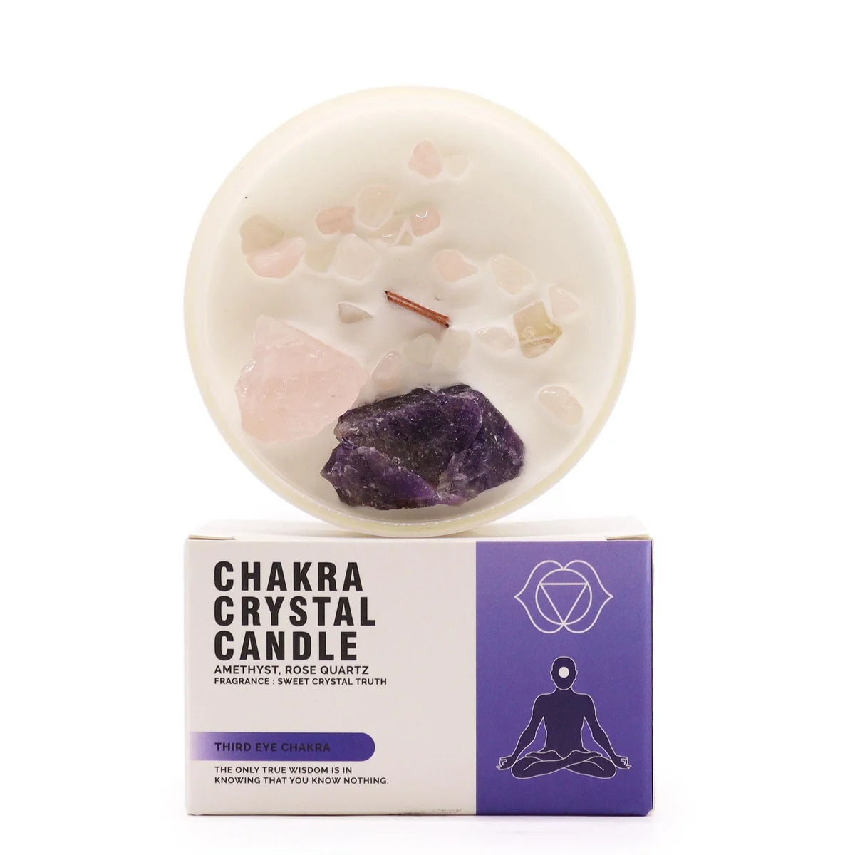 Third eye chakra candle with purple crystal embedded in a white wax candle for meditation and energy balance