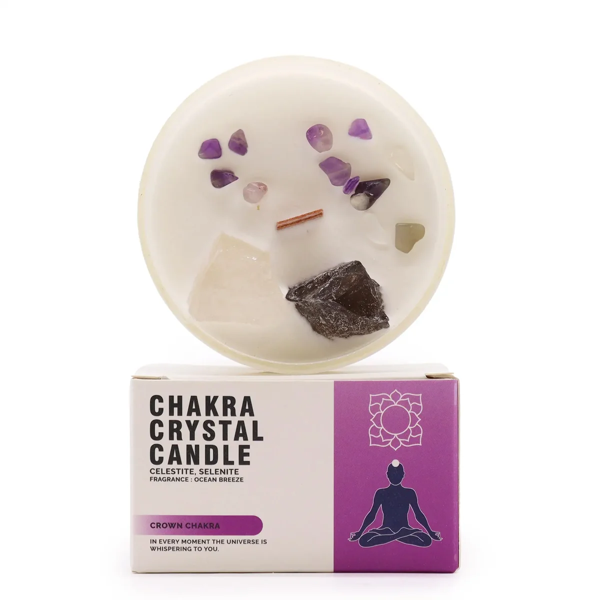 White chakra crystal candle labeled Crown Chakra with decorative crystals around the base, glowing wick lit