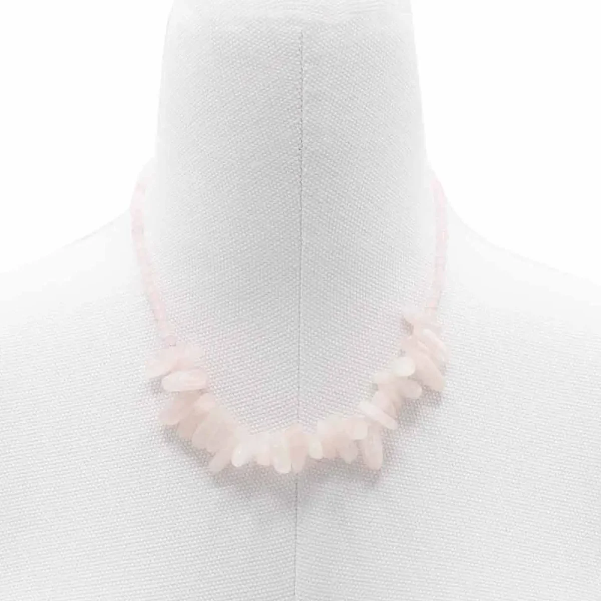 Longstone gem necklace featuring a polished rose quartz pendant on a delicate chain against a white background