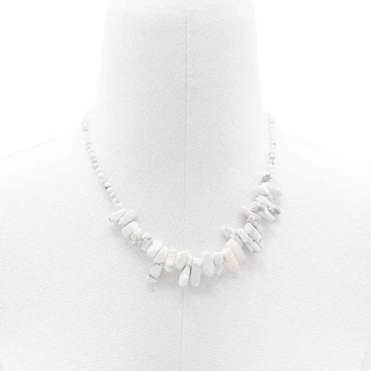 Stylish gemstone necklace featuring a white jasper longstone pendant on a delicate chain.