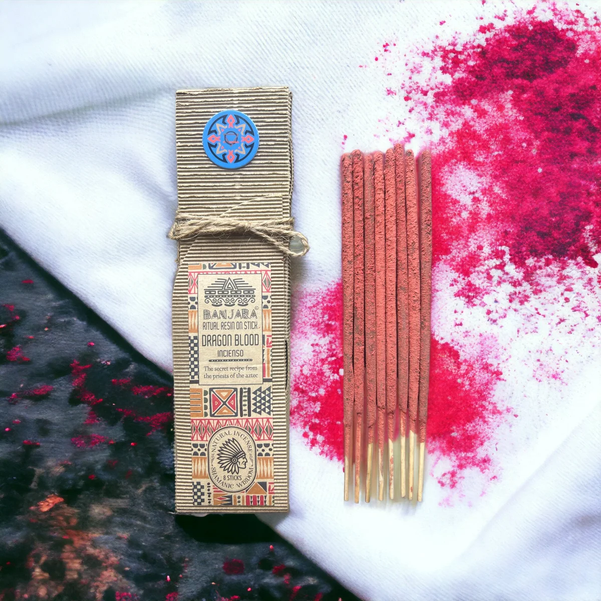 Close-up of a red Ritual Resin on Stick Dragon Blood ritual incense stick against a white background