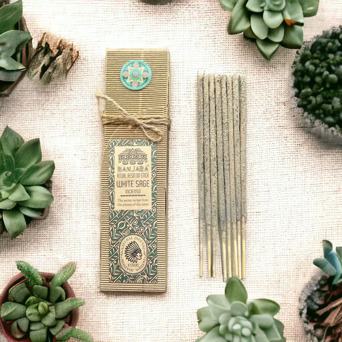 White Sage spiritual resin stick on a plain background showing natural resin texture and wooden stick base