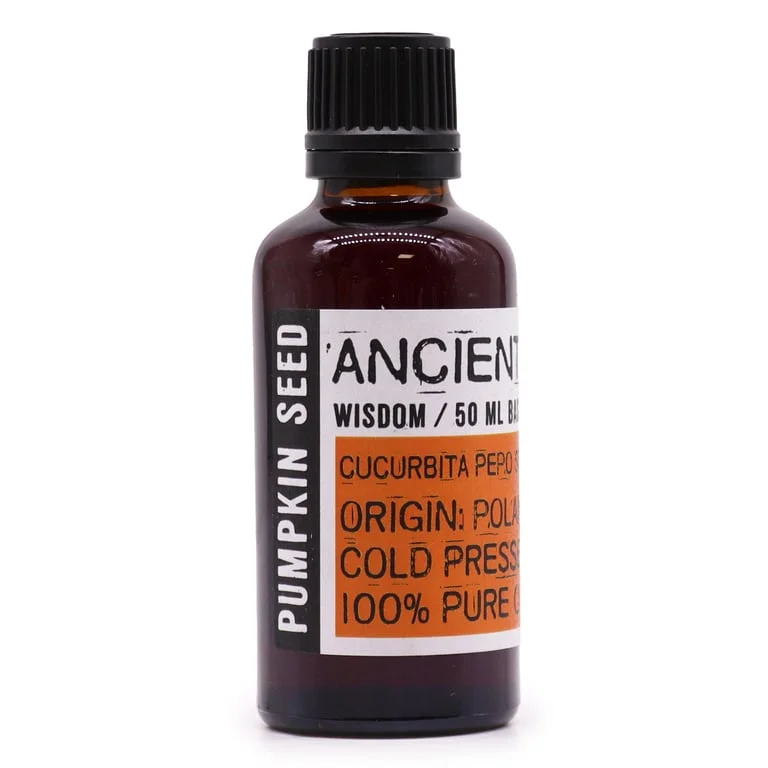 50ml bottle of pumpkin seed oil, clear glass with dark amber liquid, white cap.