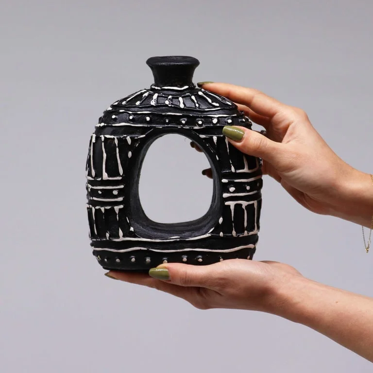 Oval donut-shaped chocolate vase, 18cm tall, with smooth curved edges and glossy finish.