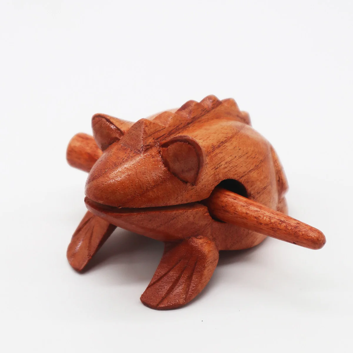 Small croaking wooden frog ornament showing detailed carved features and natural wood finish on white background