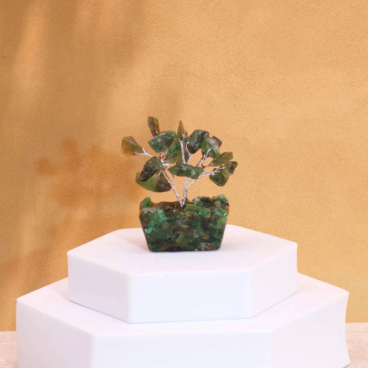 Mini green aventurine gemstone tree with 15 stones on a square orgonite base against a white background