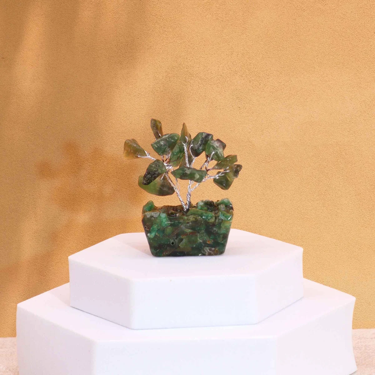 Mini gemstone tree with 15 green aventurine stones on a square orgonite base ornament against white background