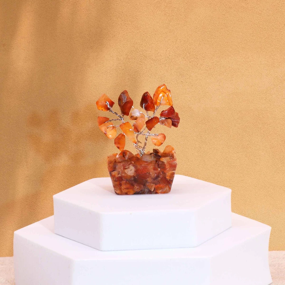 Mini carnelian gemstone tree with 15 stones on a black orgonite base, decorative and vibrant display piece